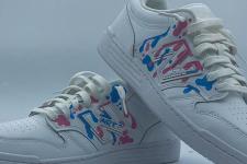white shoes splattered with blue and pink paint