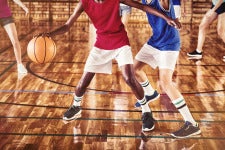 youth playing basketball