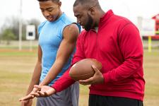 A football player and a coach