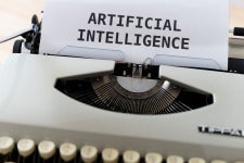 typewriter with Artificial intelligence on paper 