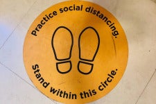 icon: practice social distancing. stand within this circle