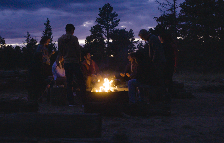 students around campfire