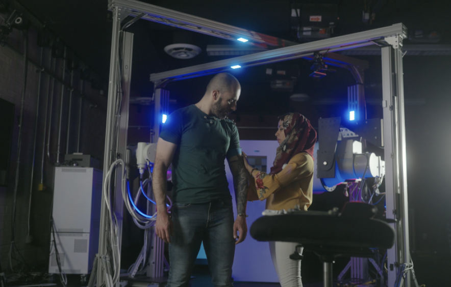 man and woman standing in a lab