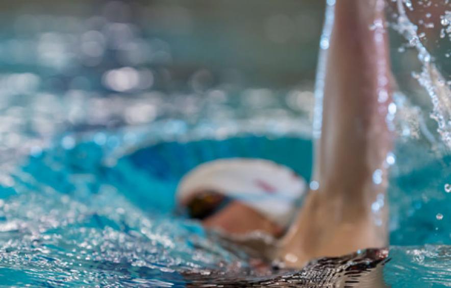 closeup of swimmer doing backstroke