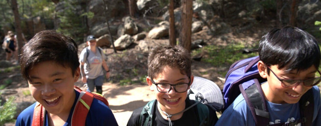 KMC PASS Campers walking through the woods