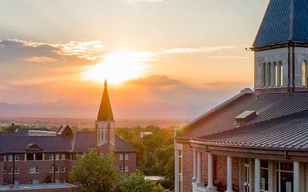 scenic aerial across campus and sunset