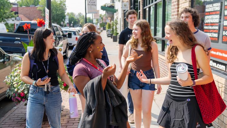 Students walking and laughing on Pearl Street