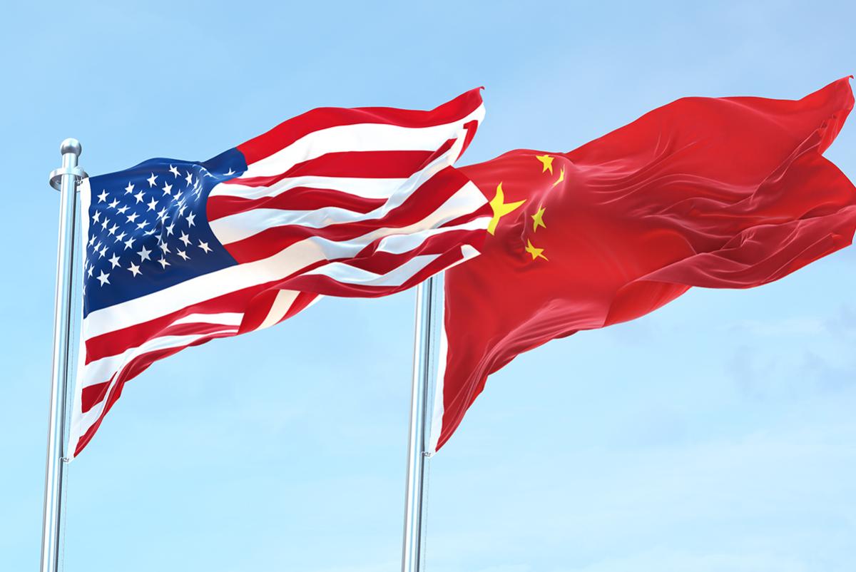USA and China flags blowing in the wind