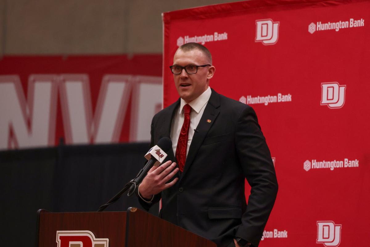 DU Men’s Basketball Coach Tim Bergstraser gives a speech on stage