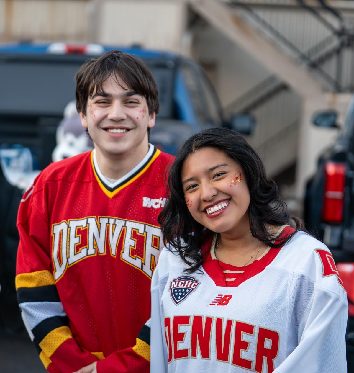 students pose for hockey tailgate event