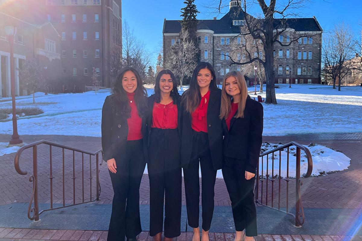 Four students pose for a photo after winning the National Diversity Case Competition