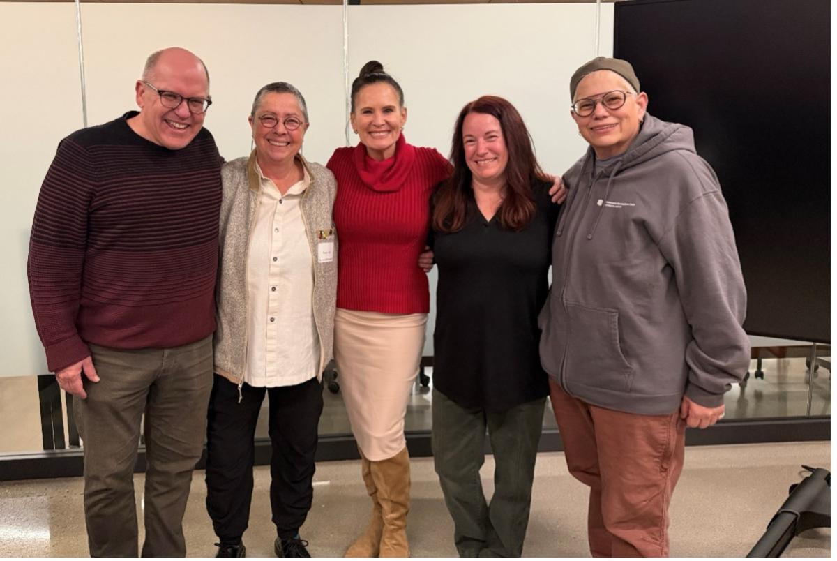 Provost Loboa stands and poses with Teacher Scholars who are being celebrated.