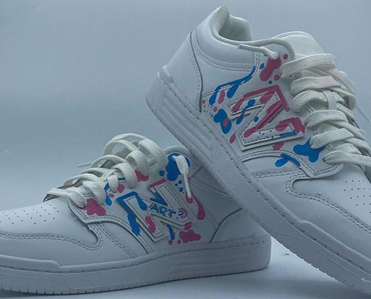 white shoes splattered with blue and pink paint