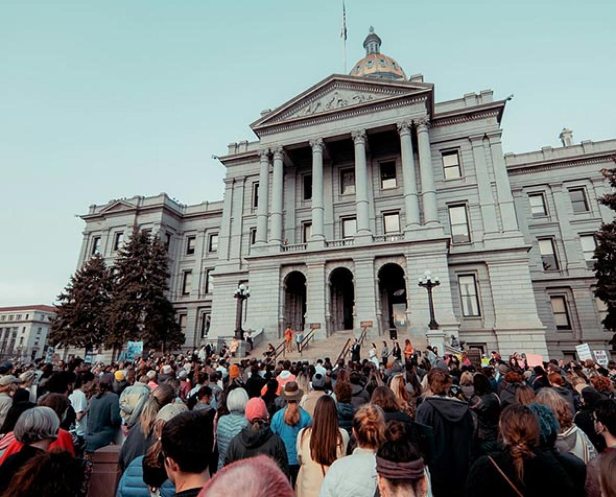Women outside denver capitol 