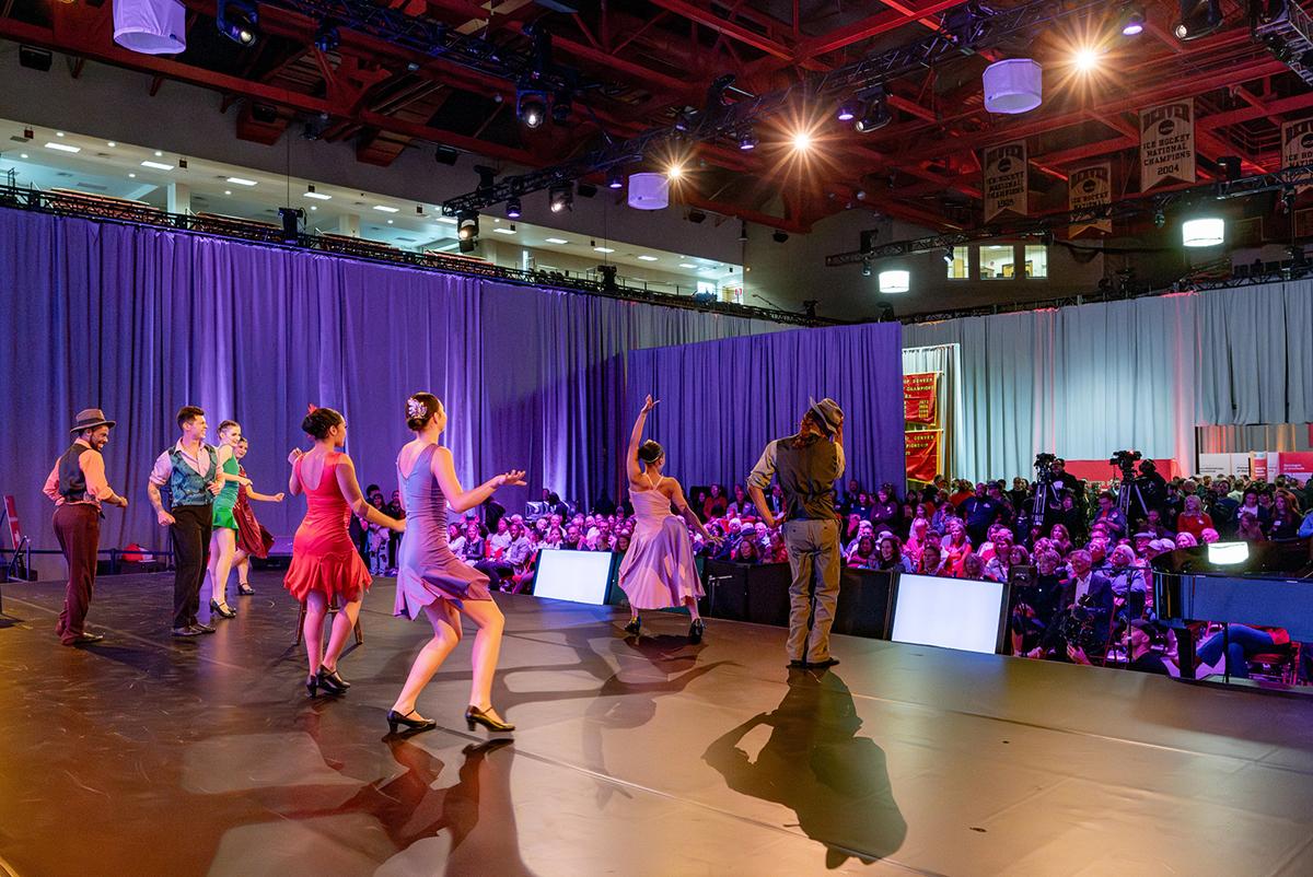 Dancers perform on stage during the Denver Difference campaign event.