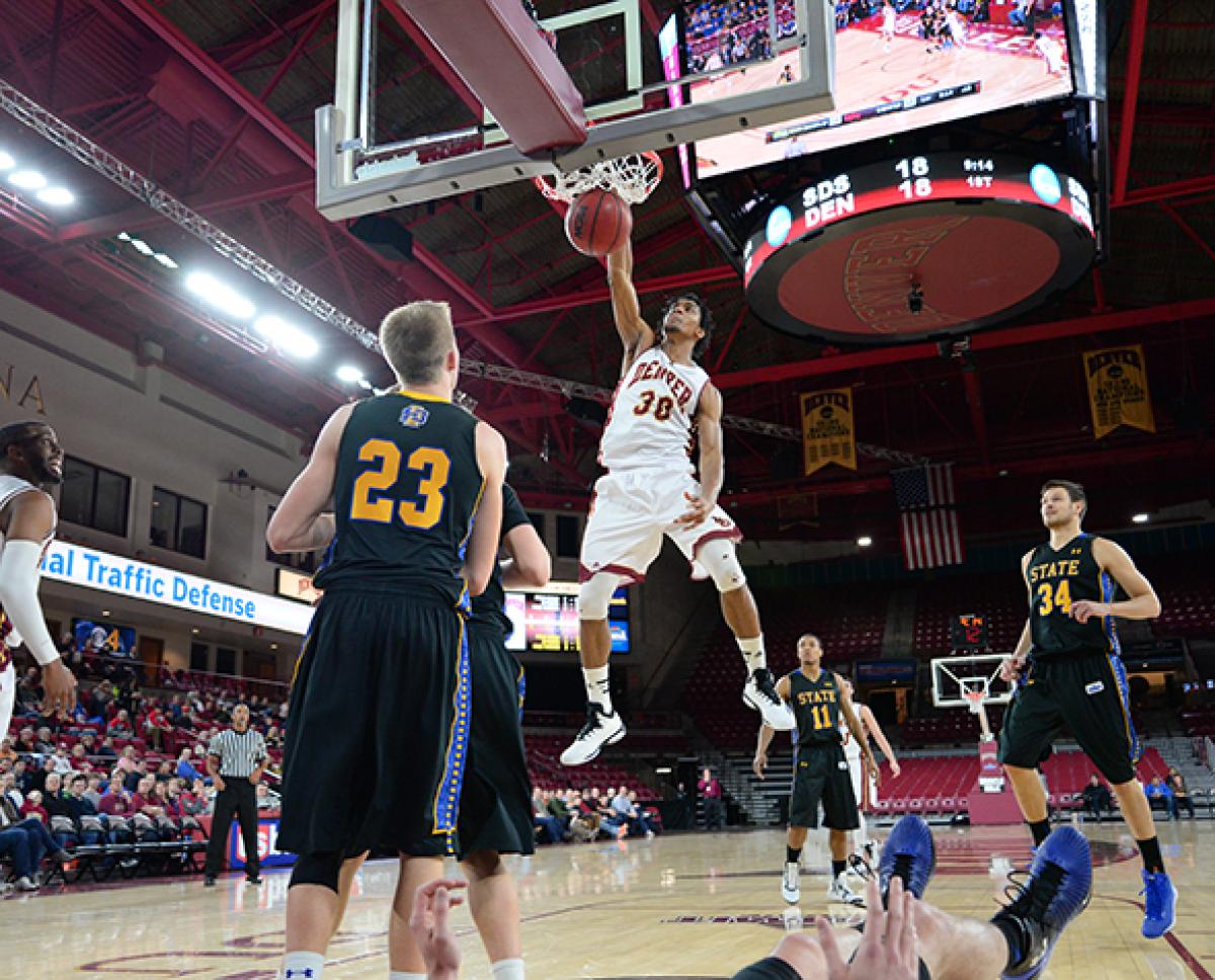 Cam Griffin dunking in a DU uniform
