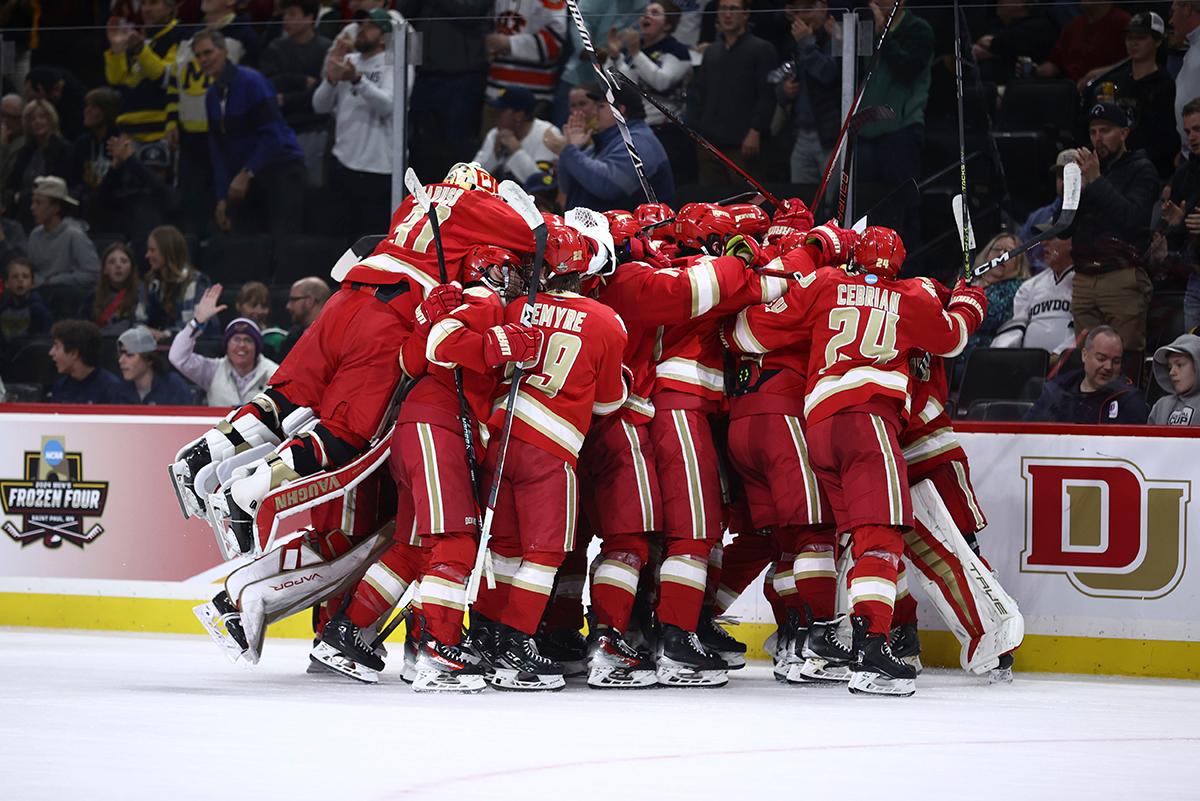 DU hockey celebrates its semifinal victory against Boston University.