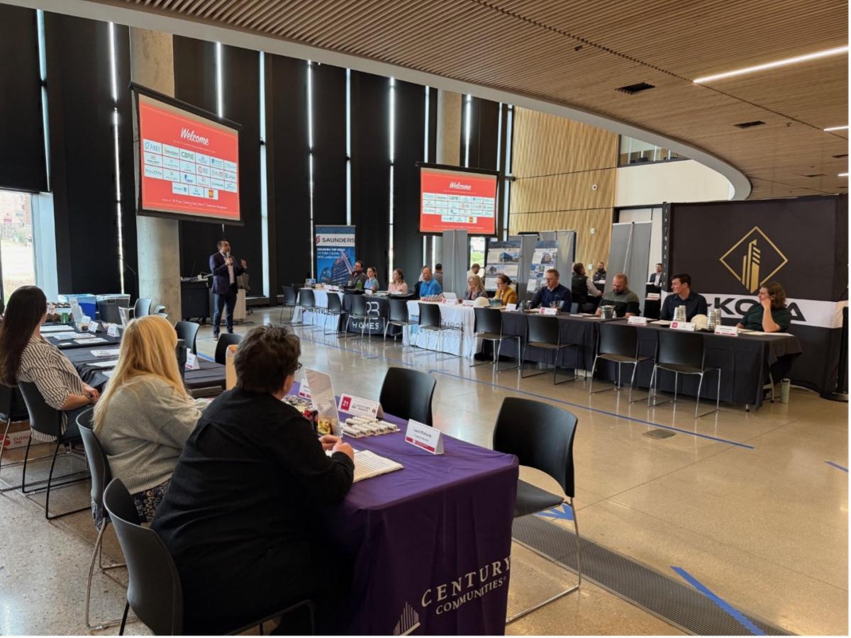 A man speaks to a crowd of people.