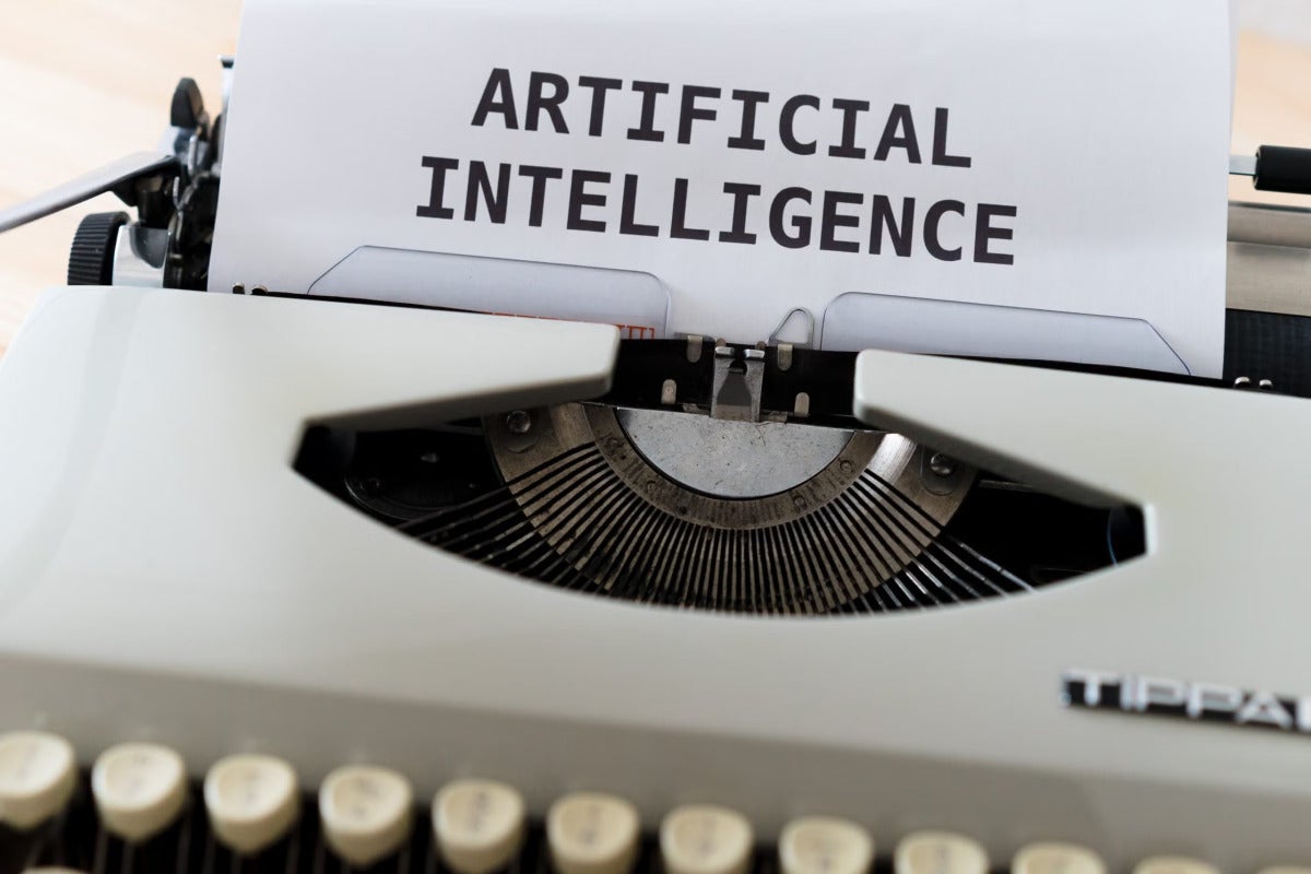 typewriter with Artificial intelligence on paper 