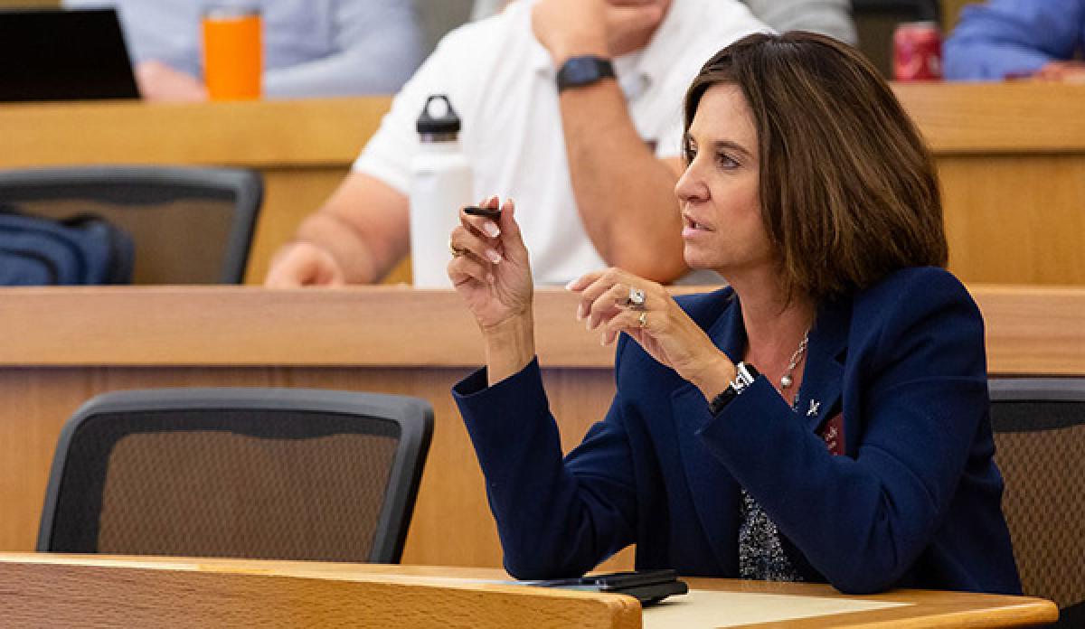 woman participates in a classroom