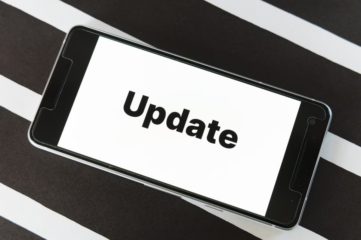 a phone that says 'update' on the screen