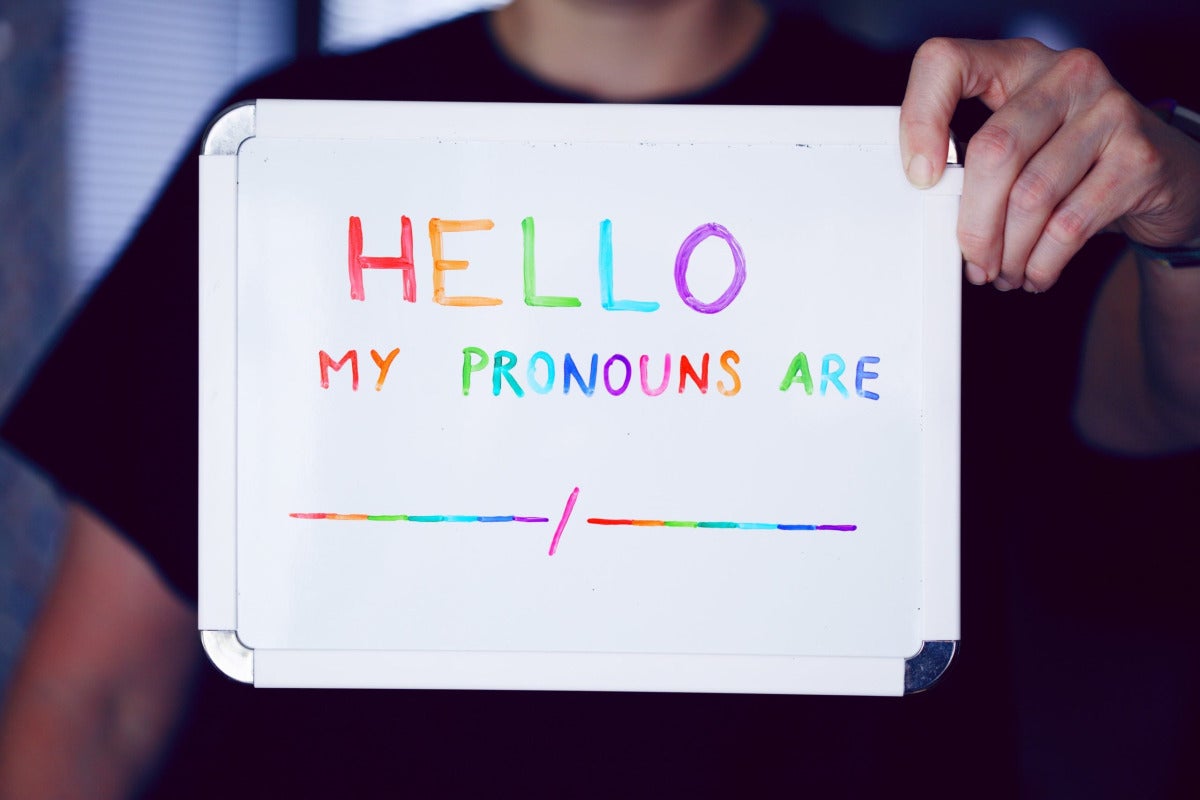 sign that says hello my pronouns are