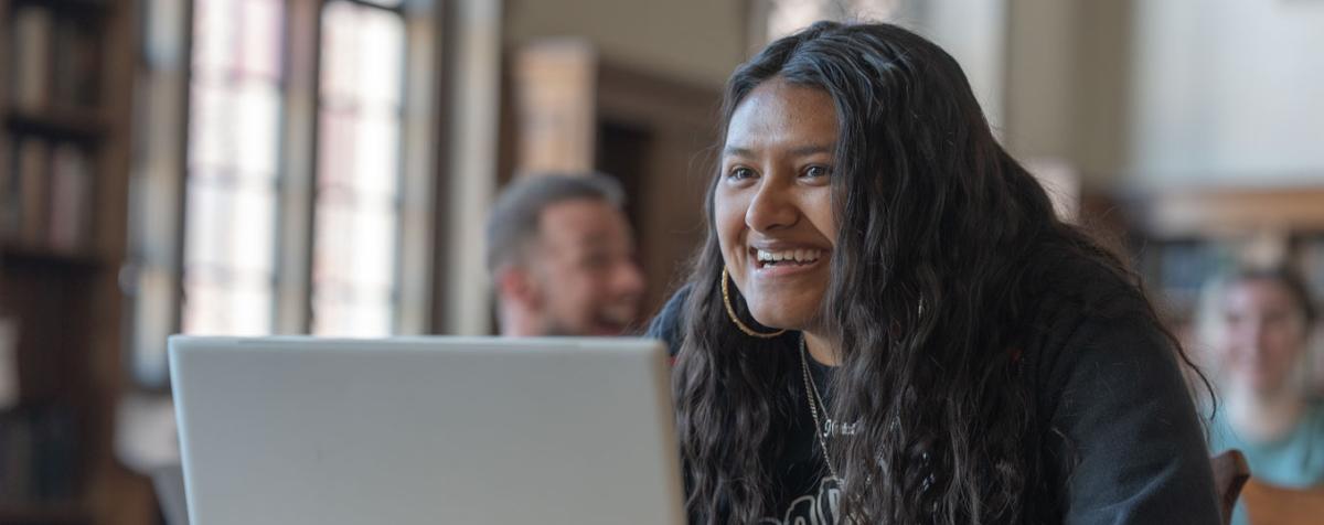 smiling young woman with laptop