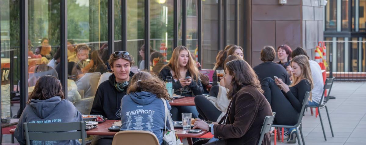 Students eating on balcony