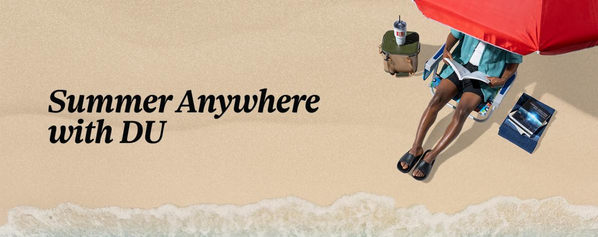 a man reading a book under an umbrella on a beach. text written "Summer Anywhere with DU" on the banner