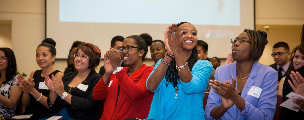 diverse students clap after watching lecture