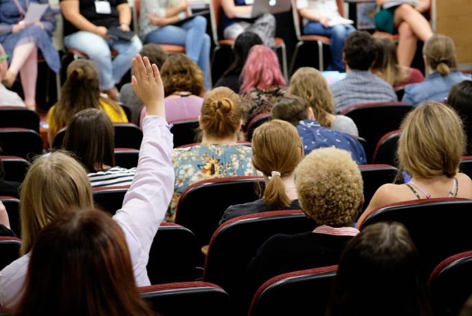 audience looks forward to panel discussion