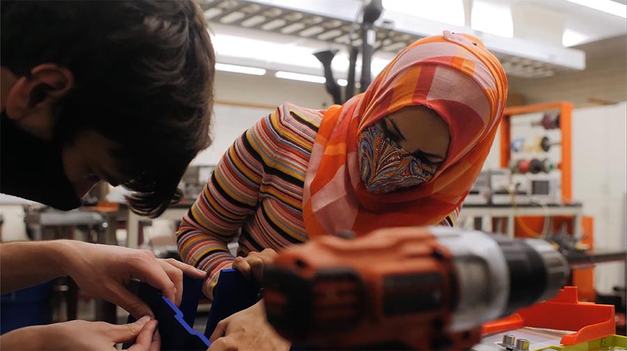 students building a structure in the lab