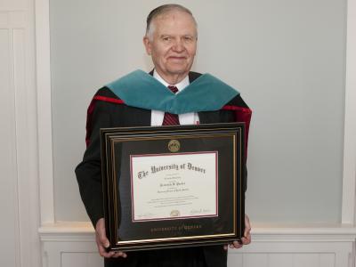 Frederick Pardee holding framed diploma 