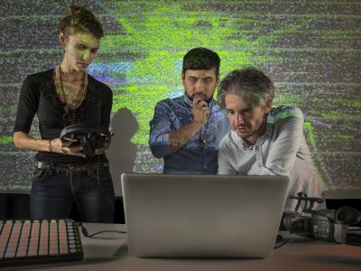 students gathered around a computer
