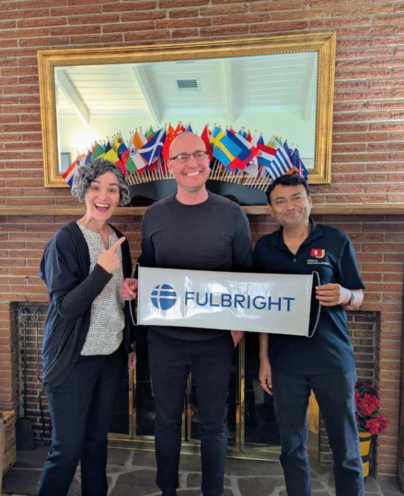 Keith Gehring and other people holding Fulbright sign