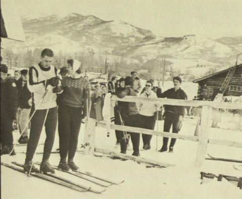 Students carry their skis on a trip with the 1958 Pioneer Ski Club