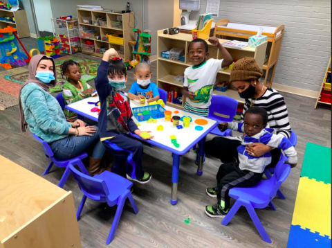 Students at a table at The Little Village