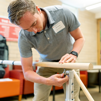 Student assembles the portable balance bar system