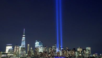 New York City skyline with beams of light