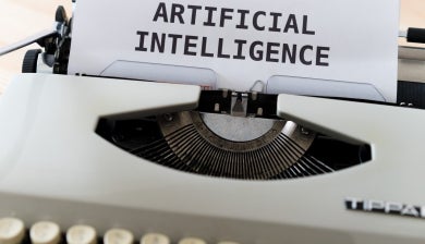 typewriter with Artificial intelligence on paper 