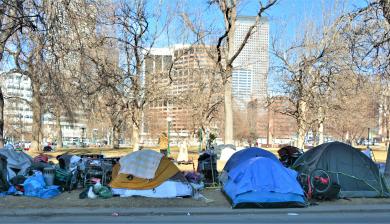 Unhoused people and their tents in downtown Denver.