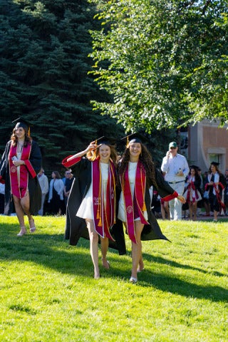 students pose at commencement