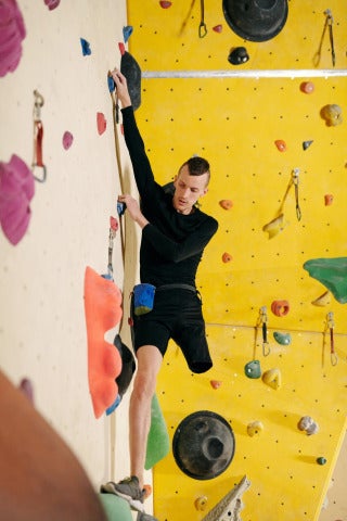 man on indoor climbing wall