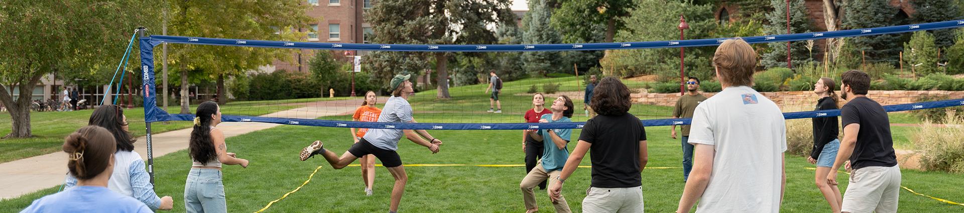 a group of students playing volleyball