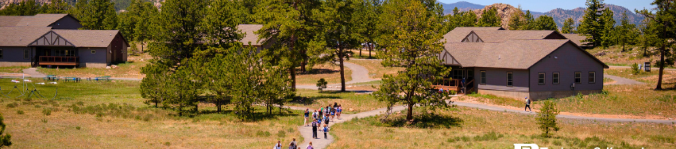 Group hiking toward KMC Cabins