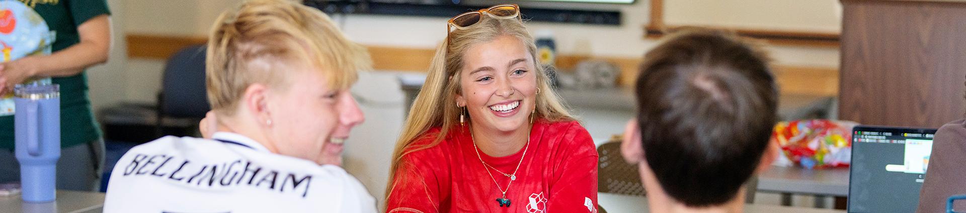 a 4D peer mentor talking to two new students