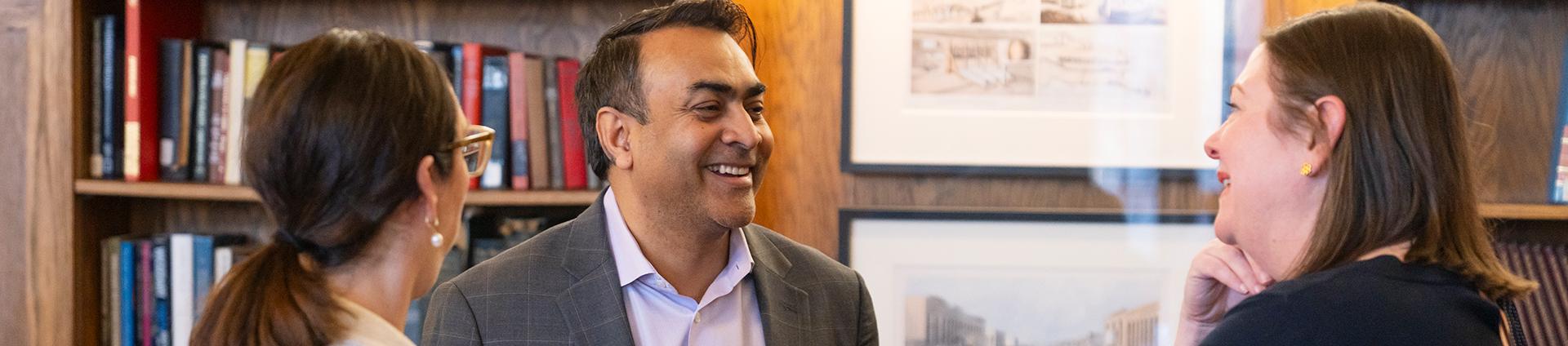 three faculty talking