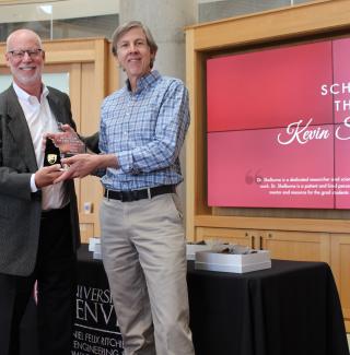 Dr. Shelburne Receiving Award from Dean Holston
