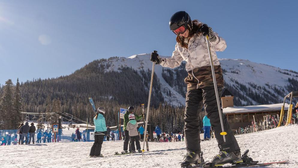 a student skis during an alpine club trip