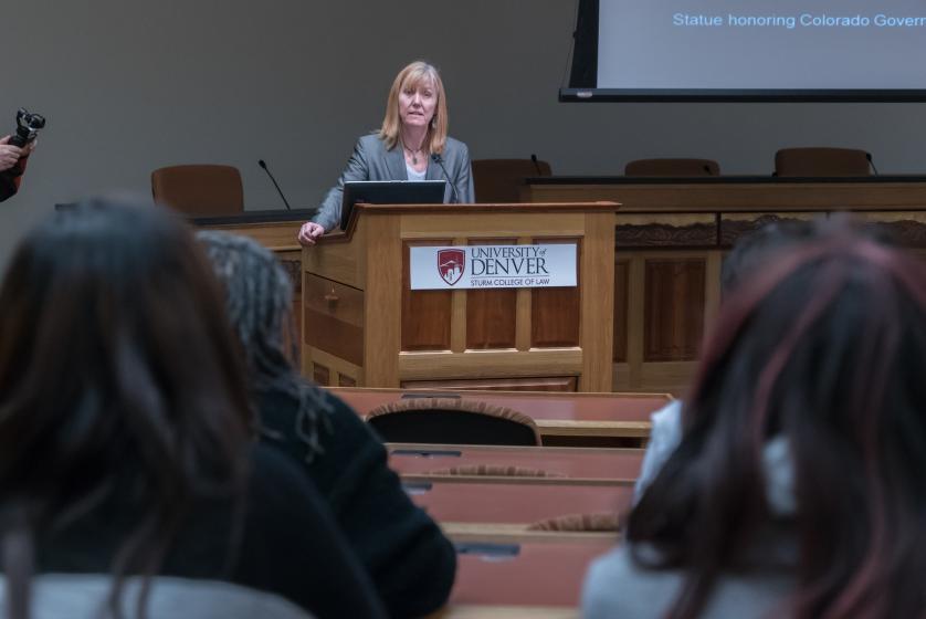 Speaking in front of podium